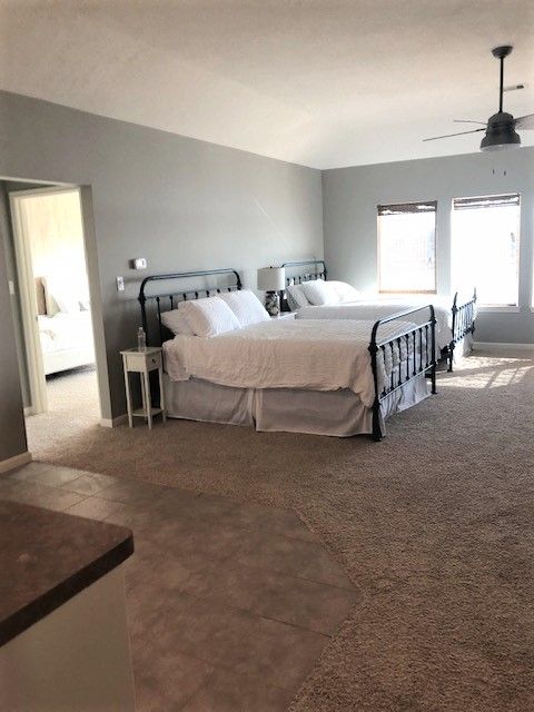 Large size residential bedroom painted gray by WALLS BY WILLIAMS of Conroe TX